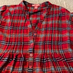 Woman within pin tuck flannel shirt